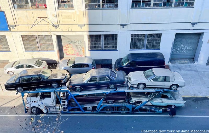 Another aerial view of Autobabysitters with cars being trucked away