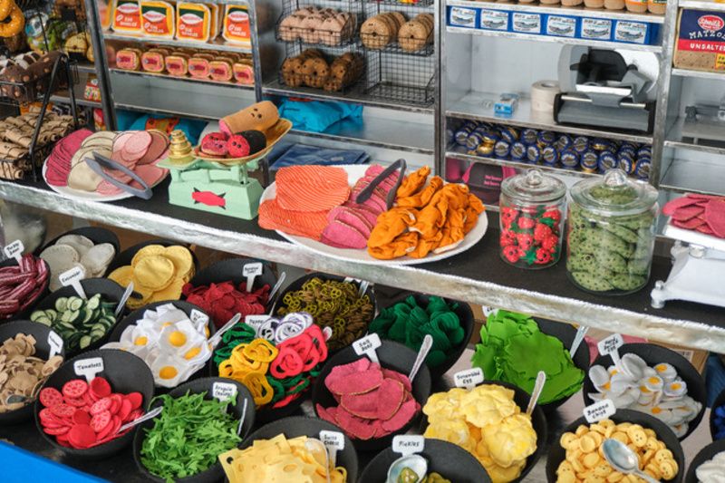 Bagel toppings and stuffings made of felt at Lucy Sparrow's Feltz Bagels