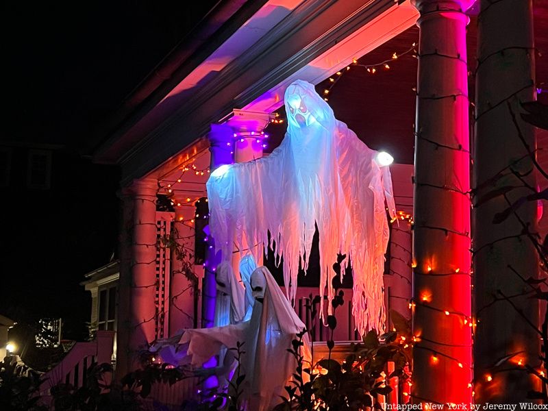 Ghost decoration hanging from a porch