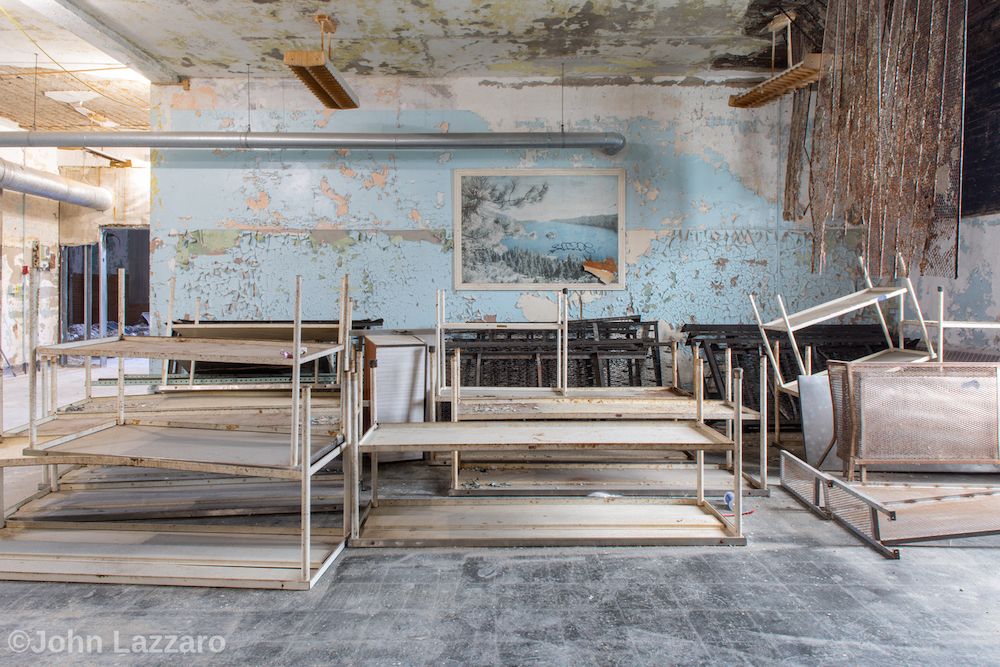 Tables stacked up in  room at former Buffalo State Hospital