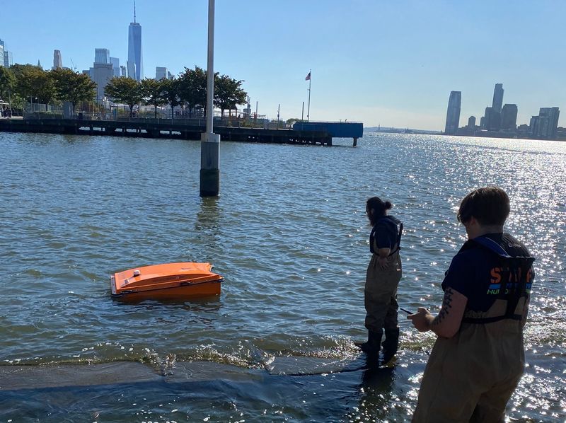 Orange WasteShark floats on the Hudson River