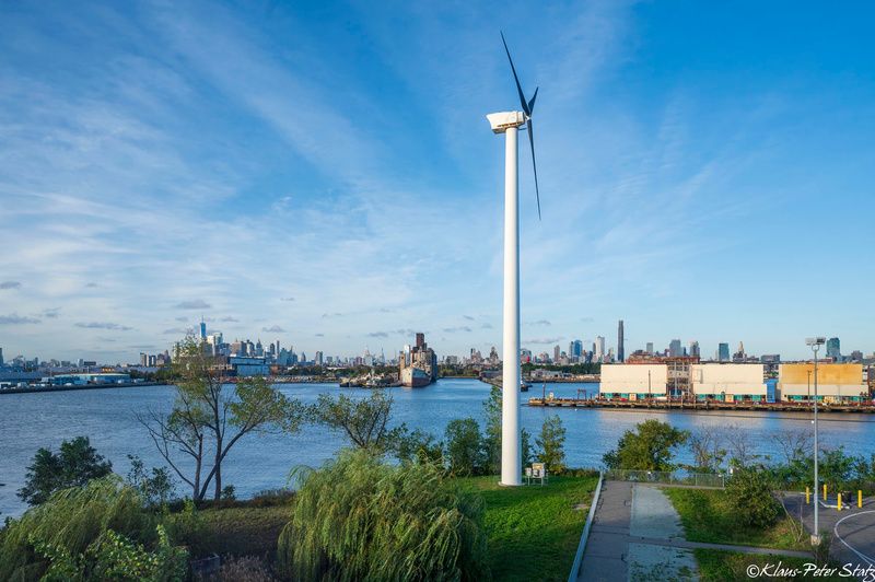 Wind turbine in sunset park