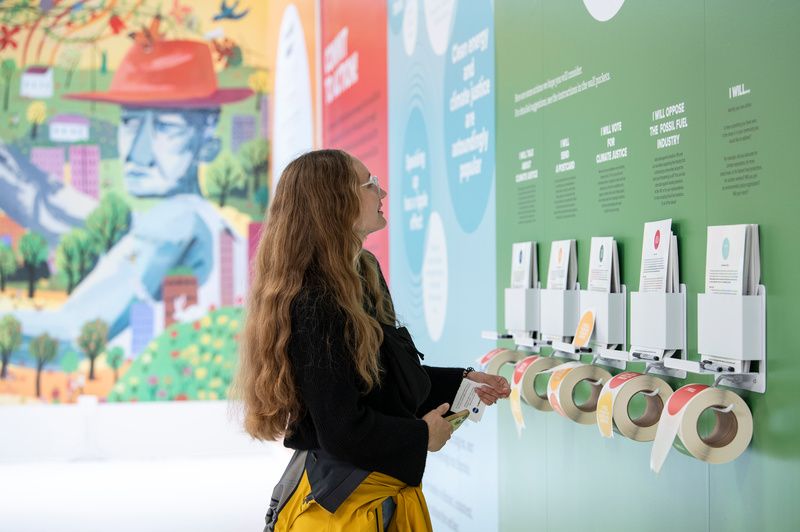 Woman looking at exhibit at Climate Change Museum