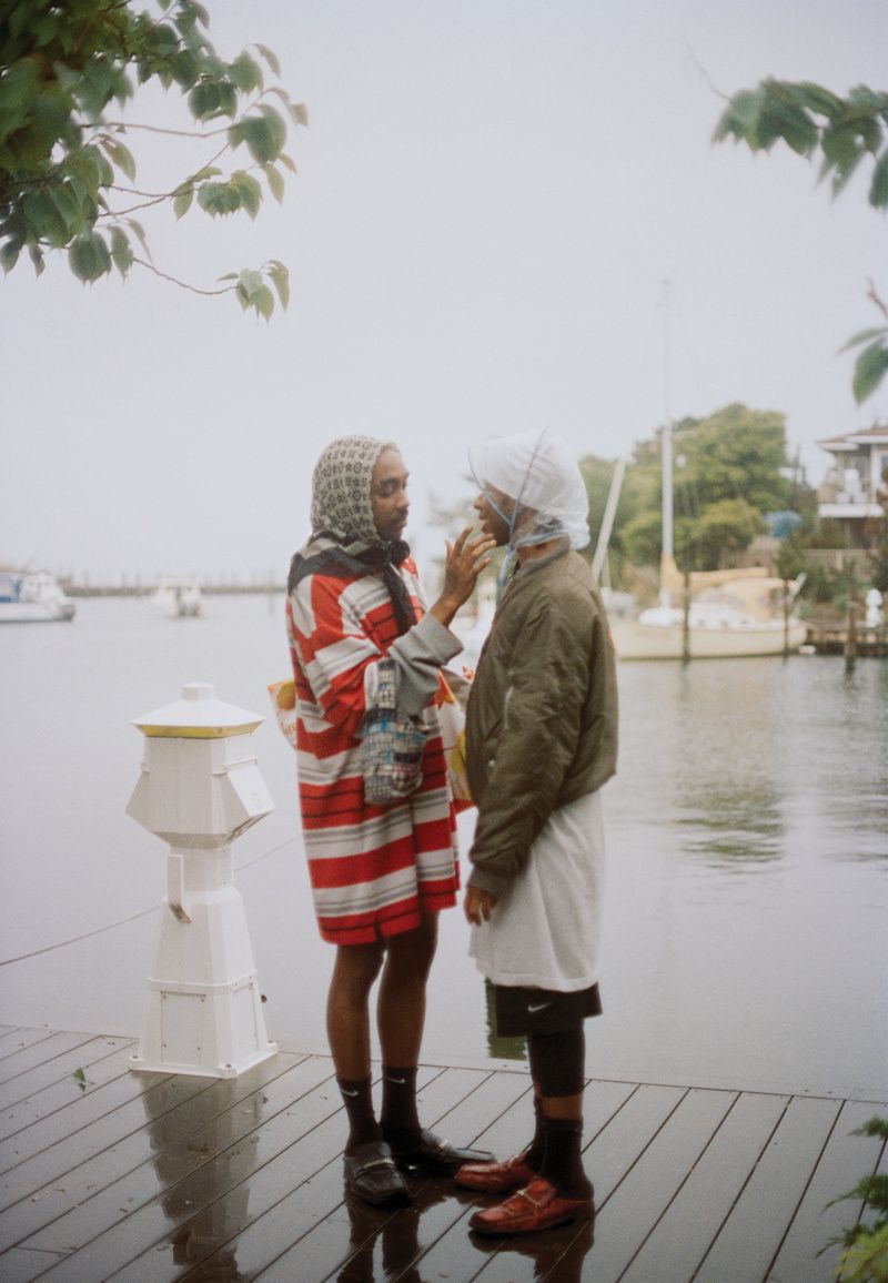 Portrait of two men in the rain