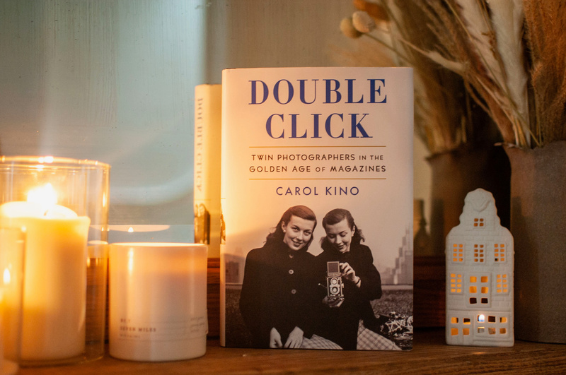 Double Click book on a mantel with candles