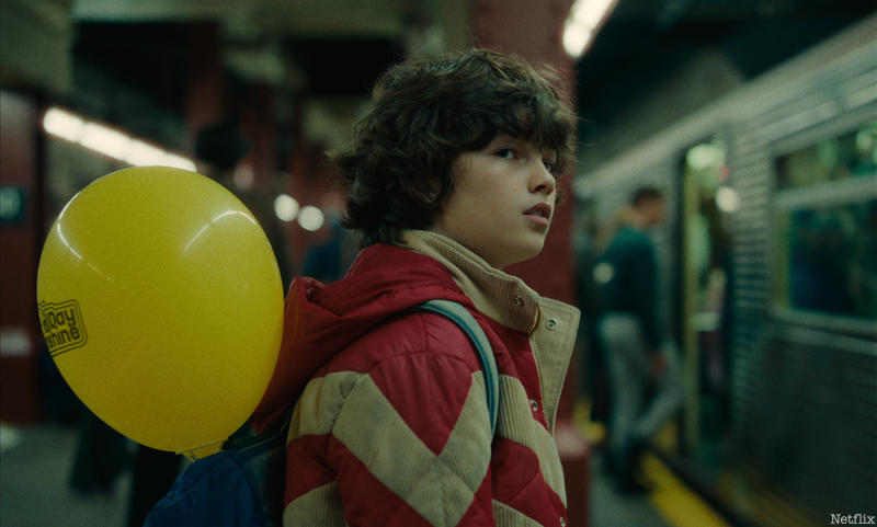 Edgar Anderson with yellow balloon in the subway