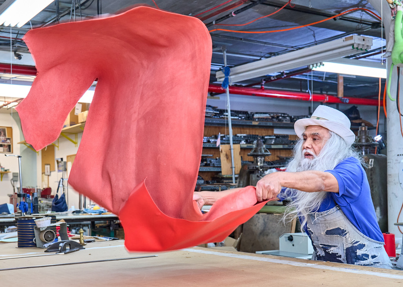 Man waves out fabric at the Brooklyn Navy Yard