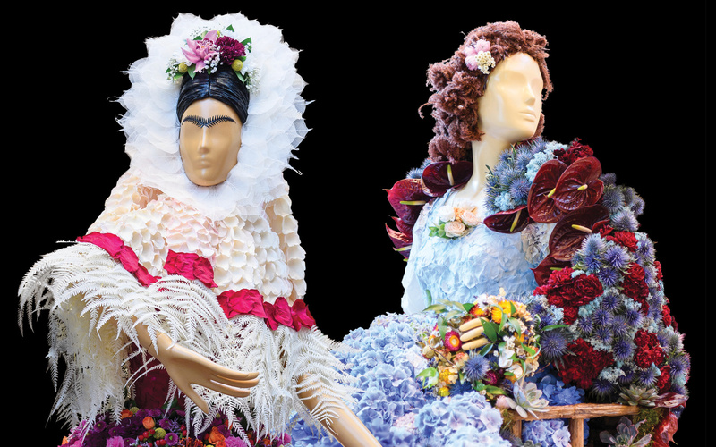 Two female mannequins in outfits made of flowers