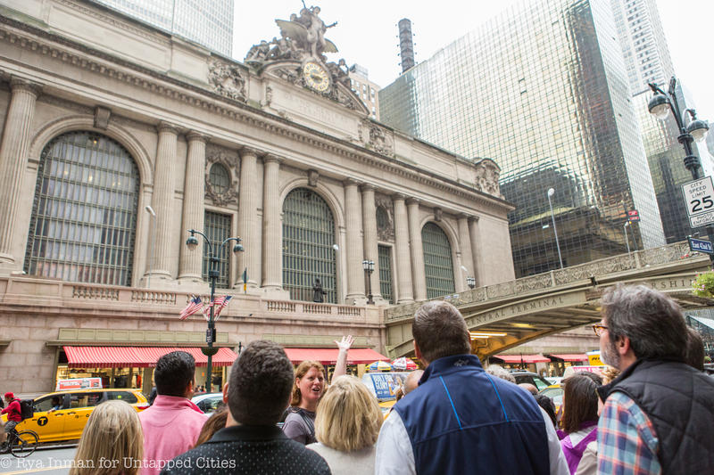 Guide Heather Shimmin gestures to the facade of Grand Central Terminal