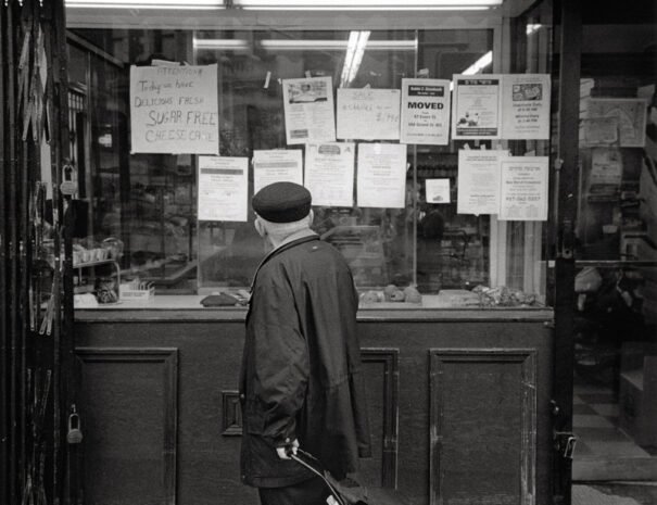 A man looking into a store window