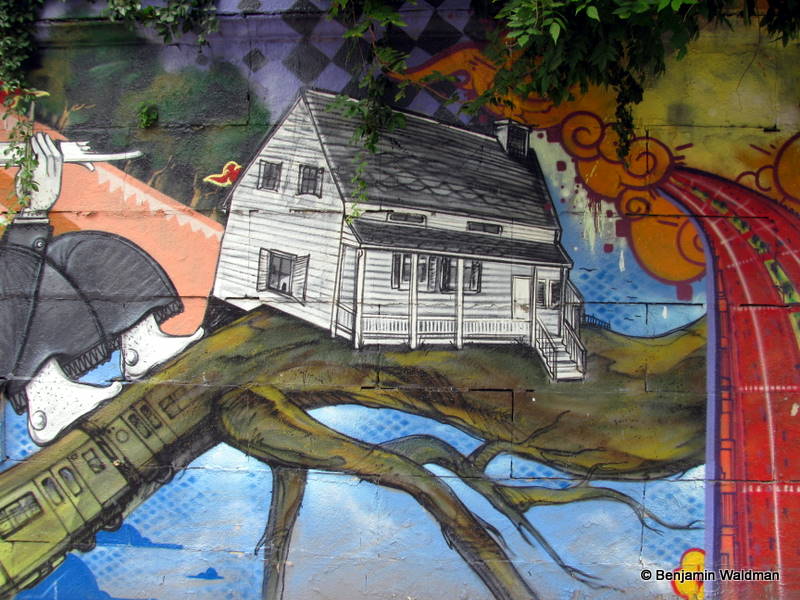 A painting of the Poe Cottage in a mural at Grand Concourse in the Bronx