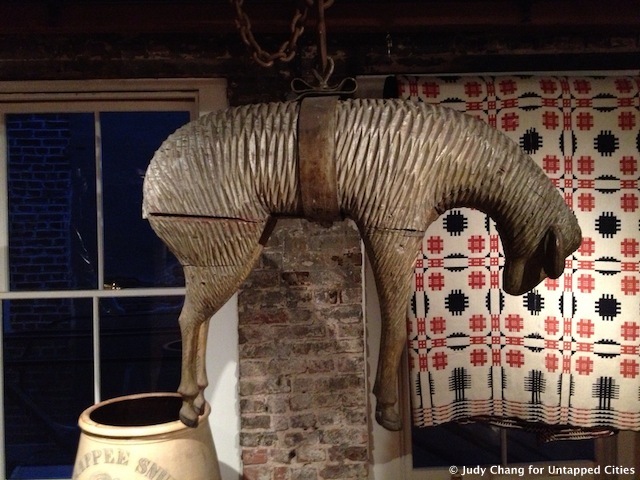 Hanging sheep like this 19th-century wooden carving were commonly displayed outside wool merchants in England and the US.