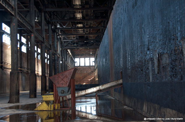 With decades of molasses coating the walls, the raw sugar warehouse looks a bit like a modern art installation.