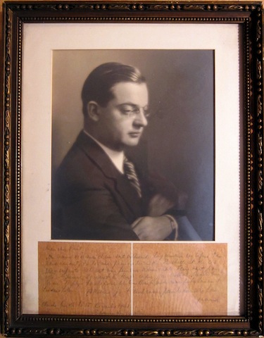 The original note, framed beneath a photo of Jean.