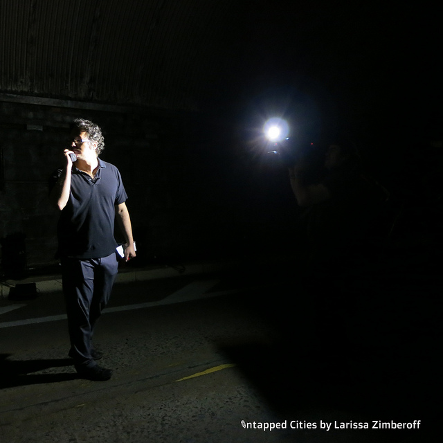 Rafael Lozano-Hemmer, the artist of the Voice Tunnel, is filmed while chatting with his tech staff.