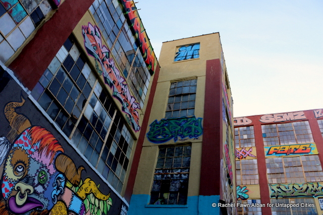 Around 5 Pointz are several "Memorial Walls" that pay respect to artists who have passed away. There are also artworks by artists who have died, including this blue and green piece (center) by Sey-One.