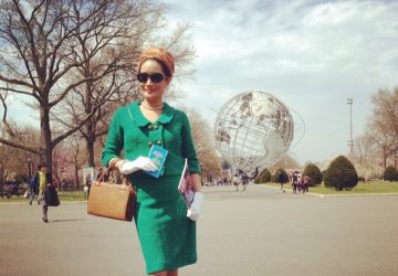Woman posting in front of Unisphere