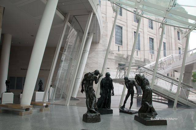 Rodin's Burghers of Calais stand in the Rubin Entrance Pavilion of the Brooklyn Museum.