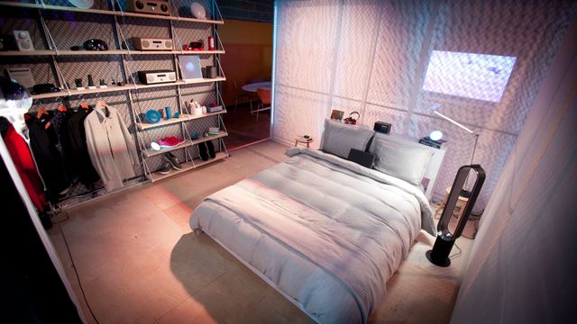 The bedroom of the future features an American-made mattress and a Dyson tower fan