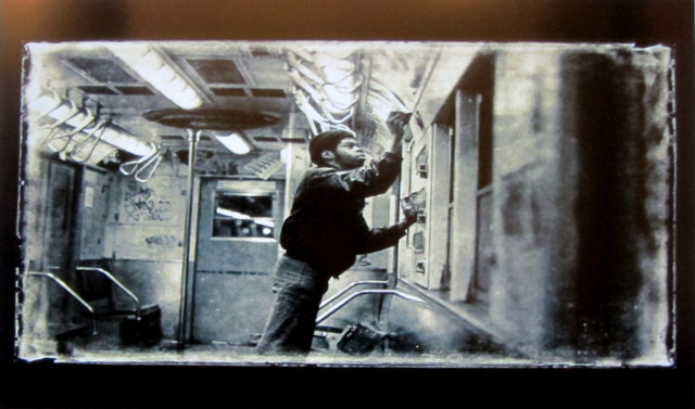 One of the photographs included in the presentation by Flint. A writer himself as well as a photographer, Flint's work offers rare glimpses into the graffiti culture of that time, such as this image of a writer tagging inside a subway car.