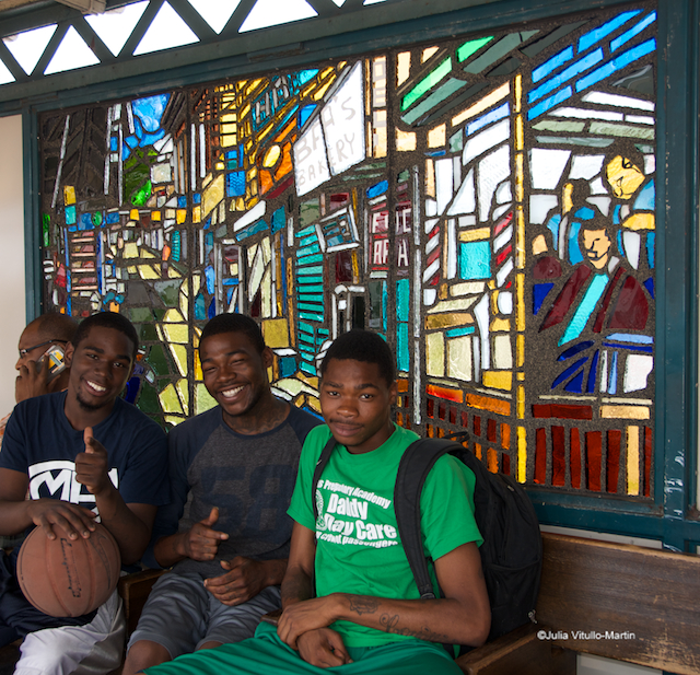 Basketball players in front of Daniel Hauben's "Under the El," installed by the MTA on Freeman Street in 2005