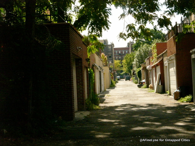 Behind the 146 row houses is an alley where each townhouse has a garage.