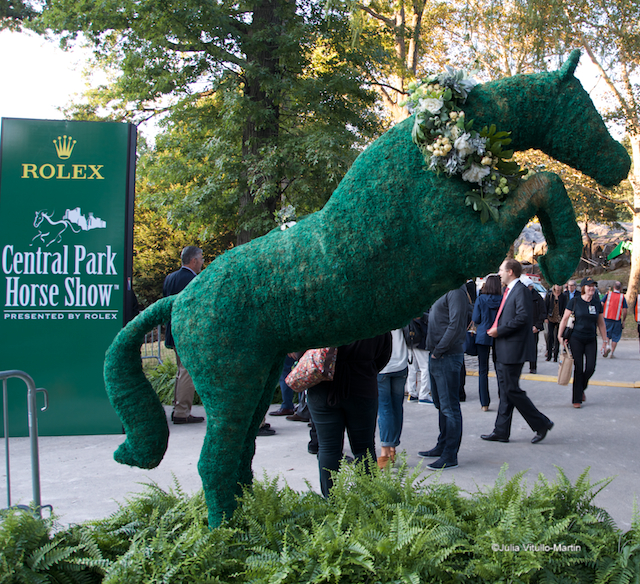 Topiaries of jumping ponies mark entrances to Central Park Horse Show.