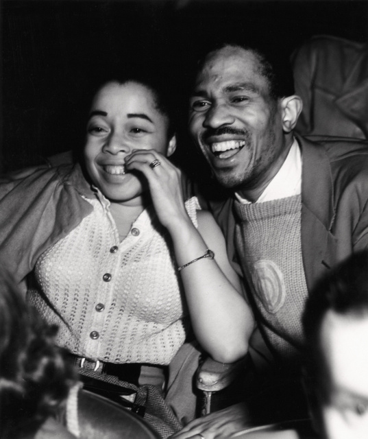 Weegee-Woman-and-man-laughing-in-a-movie-theater-International Center of Photography-NYC
