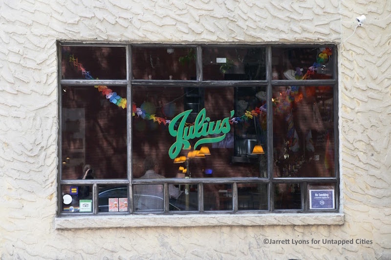 Julius' Bar window, and LGBTQ+ landmark