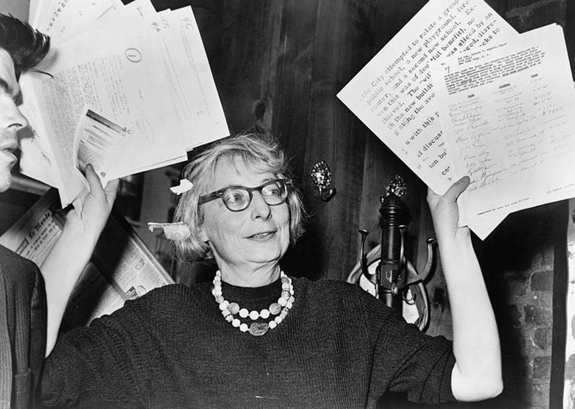 Jane Jacobs holding papers