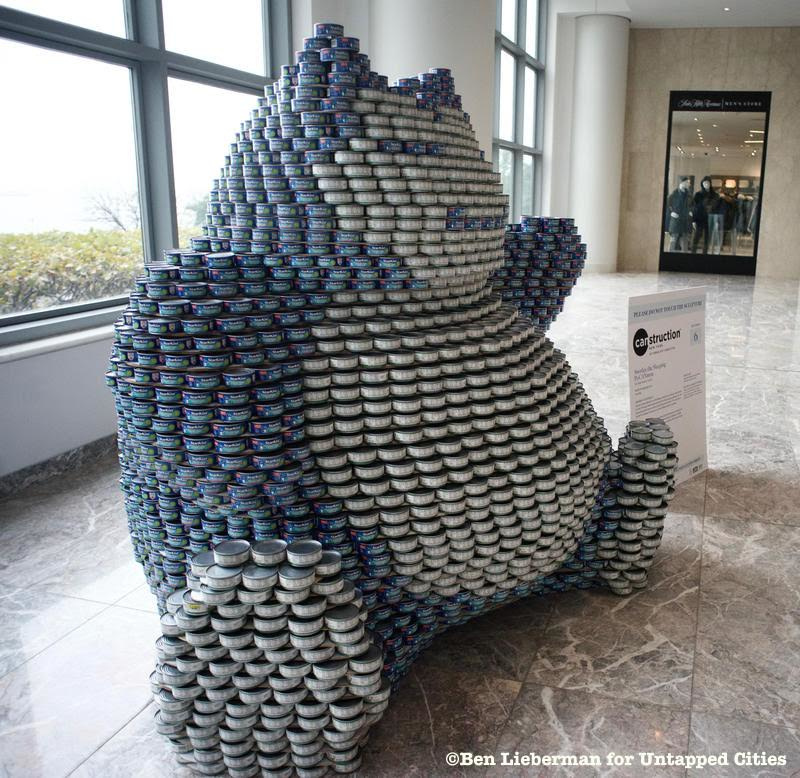 A pokemon sculpture made out of canned food