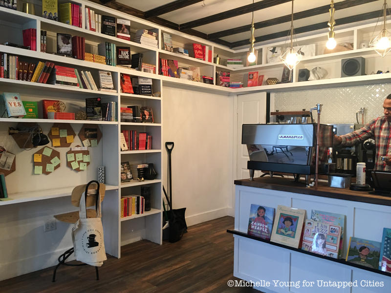 Cafe con Libros bookshelves near the coffee counter