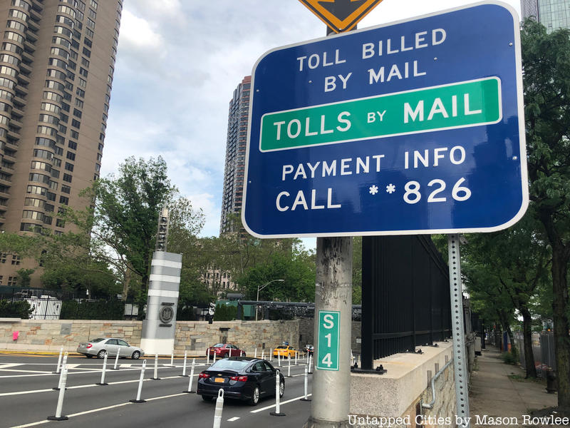 Street sign that says "toll billed by mail"