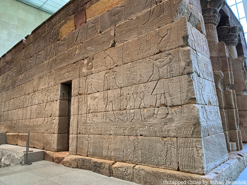 A close up view of engravings on the exterior wall of the Temple of Dendur.
