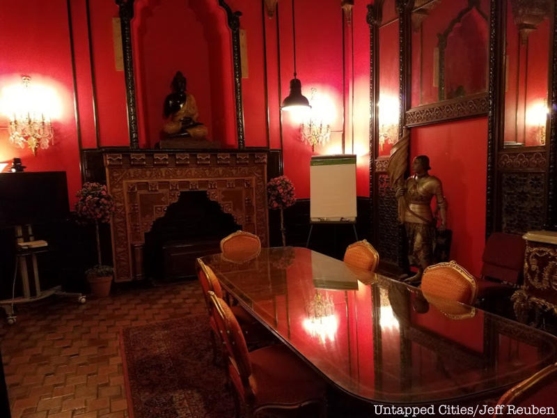 A red men's smoking lounge at the United Palace