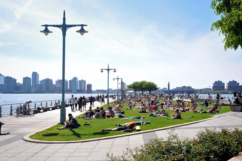 People sunbathing at Hudson River Park