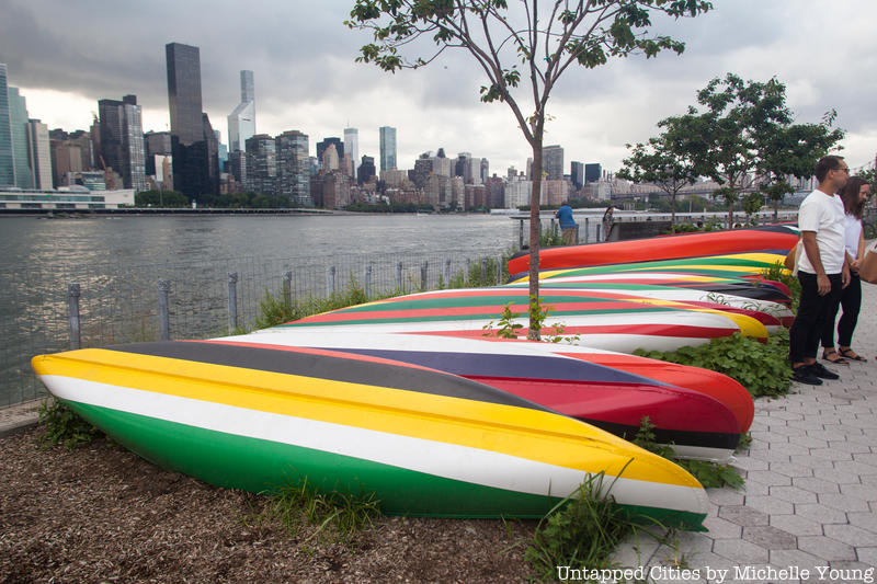 A row of kayaks along the river