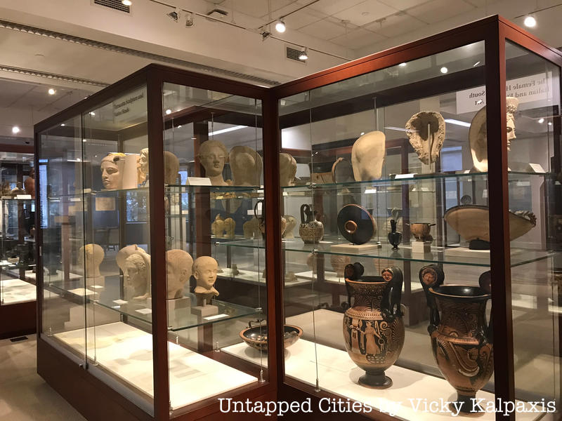 Ancient artifacts in glass cases ate the Fordham Museum of Greek, Etruscan, and Roman Art