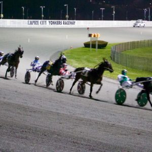 Horses running on the track at Yonkers Raceway