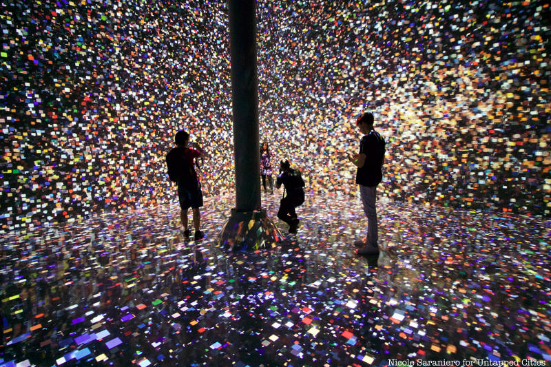 A confetti-like digital projections cover the walls of Artechouse in Chelsea Market