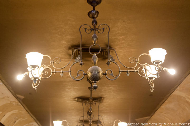 A close up of the original gas lamps on the ceiling of Gage & Tollner