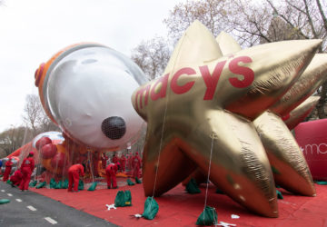 Astronaut Snoopy and gold start Macy's balloons