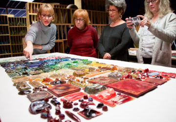 Guests admire glass jewels at the Tiffany Glass Archives behind-the-scenes tour