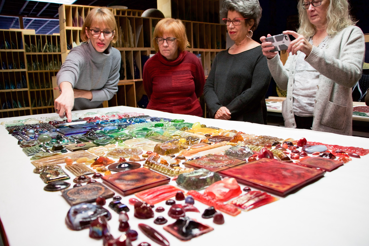Guests admire glass jewels at the Tiffany Glass Archives behind-the-scenes tour