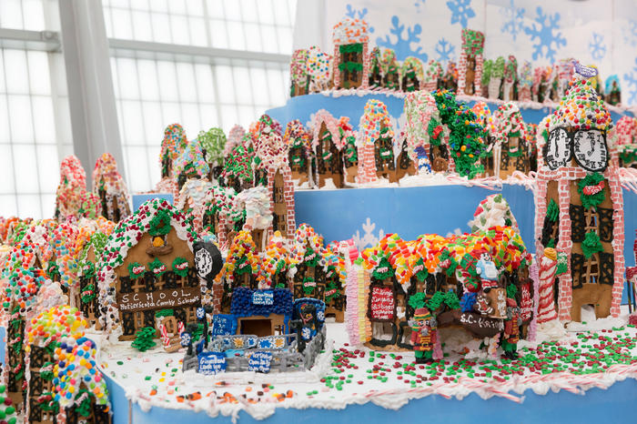 Rows of gingerbread houses at Gingerbread Lane inside the New York Hall of Science