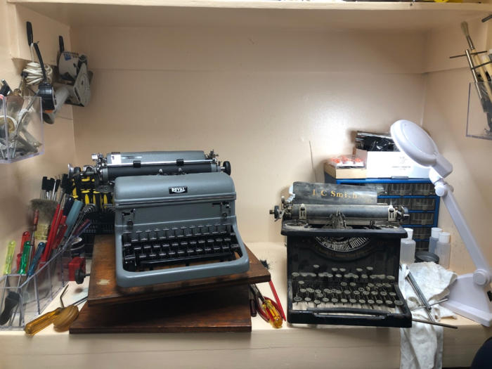 Old typewriters on a workbench