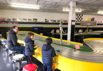 Children and father at Buzz-a-Rama slot car raceway in Kensington Brooklyn