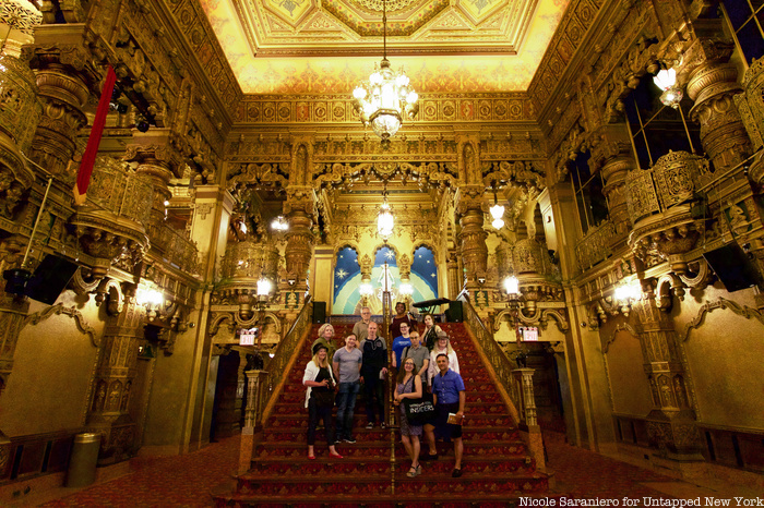 Insiders on the steps of the lobby at the United Palace Theater