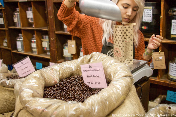 Staff measuring coffee beans at Porto Rico