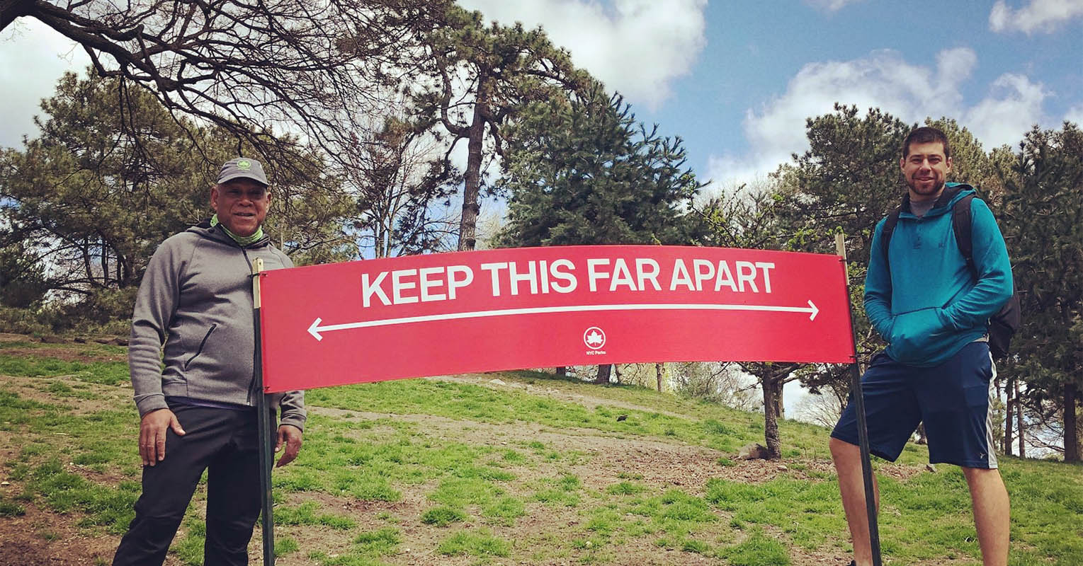 Mitchell Silver with Keep This Far Apart Social Distancing sign